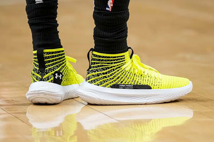 Atlanta Hawks guard Patty Mills' yellow and white Under Armour shoes.